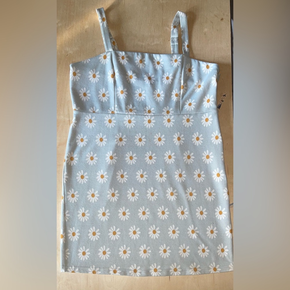 Powder blue, daisy-patterned sleeveless mini dress with adjustable sleeves